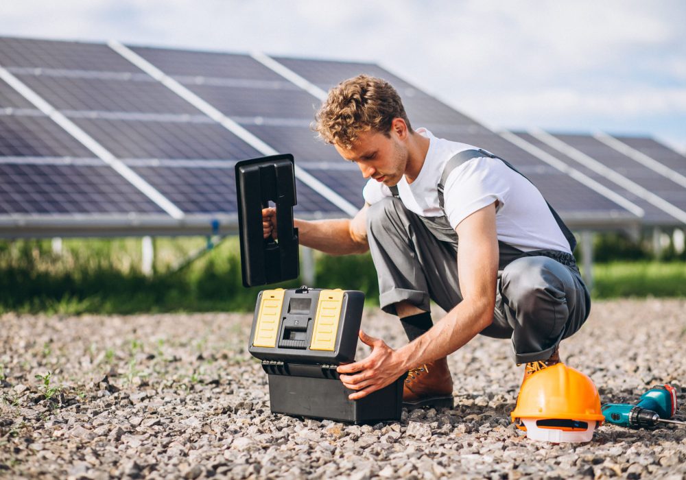 man-worker-firld-by-solar-panels man-worker-firld-by-solar-panels